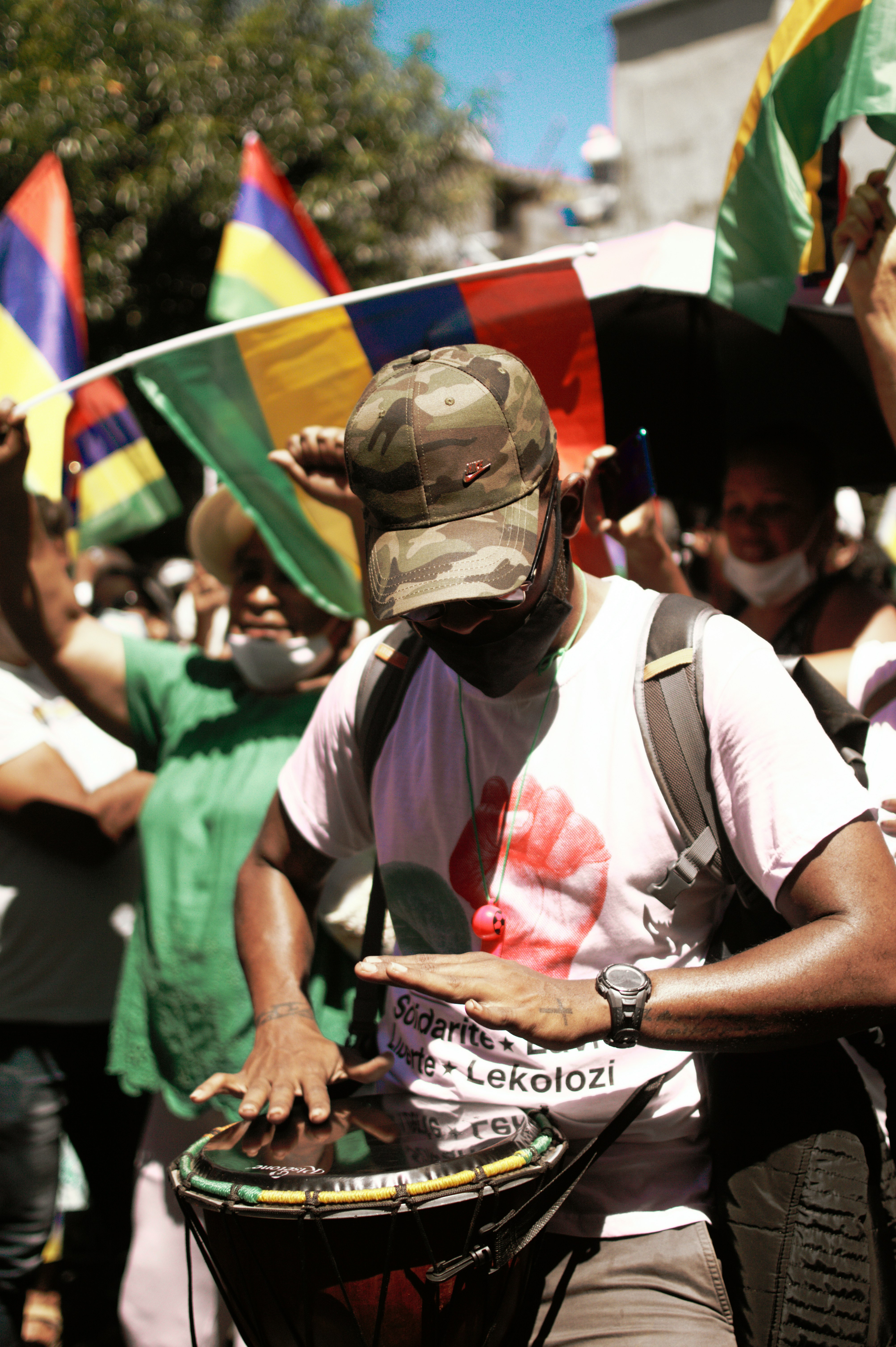 man in white and green shirt wearing black helmet